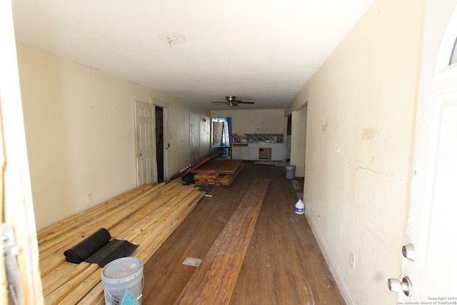 hallway with hardwood / wood-style floors