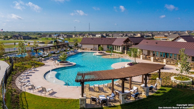 view of swimming pool with a patio area