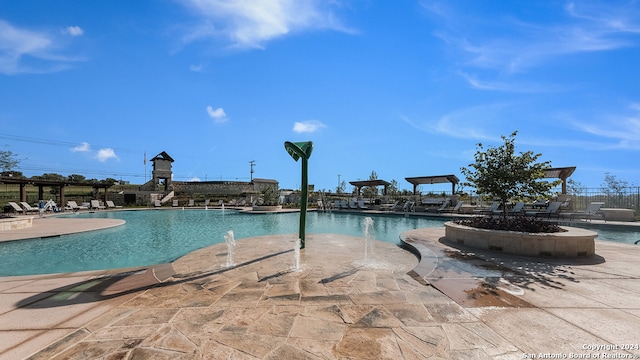 view of pool featuring a patio area and pool water feature