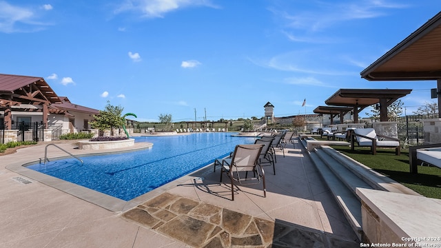 view of swimming pool featuring a patio