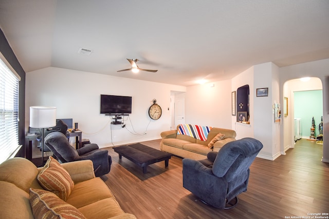 living room featuring ceiling fan, hardwood / wood-style flooring, and vaulted ceiling