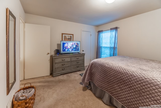 bedroom with light carpet