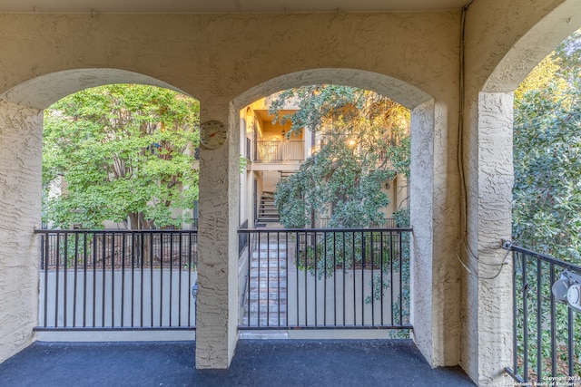 8702 Village Dr Unit 507, San Antonio, TX 78217 - view of exterior entry featuring a balcony