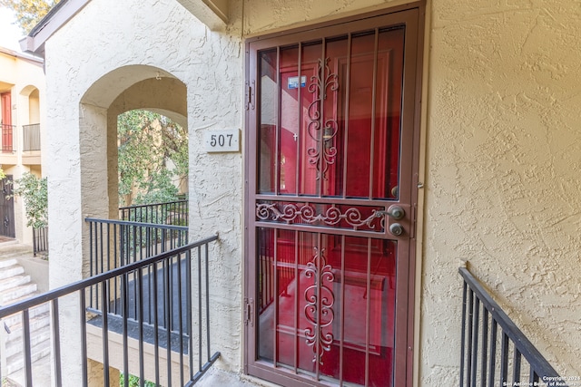 property entrance with a balcony