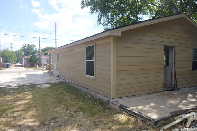 view of property exterior featuring a patio area