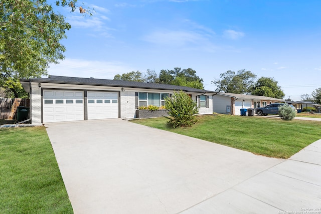 ranch-style house with a front yard and a garage