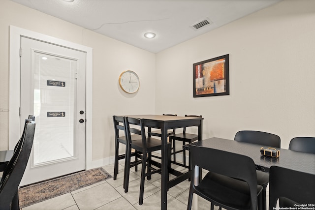 dining space with light tile patterned floors