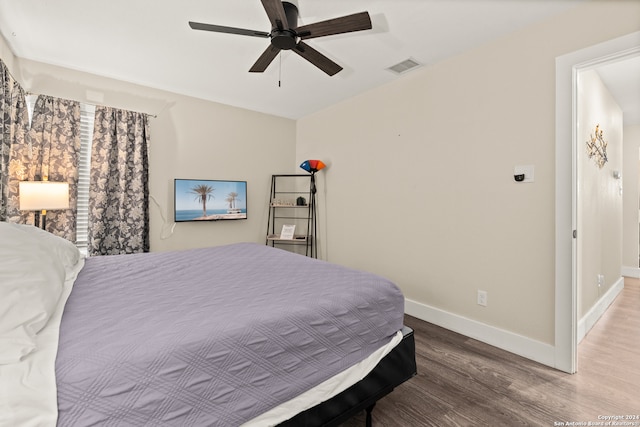 bedroom featuring wood-type flooring and ceiling fan