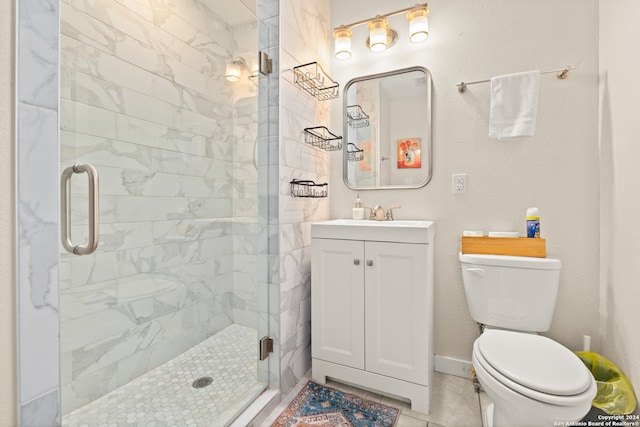 bathroom featuring vanity, walk in shower, toilet, and tile patterned flooring