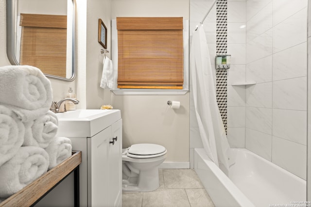 full bathroom with vanity, shower / tub combo with curtain, toilet, and tile patterned flooring