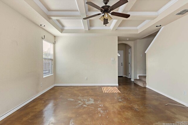 empty room featuring ornamental molding, ceiling fan, beam ceiling, and coffered ceiling