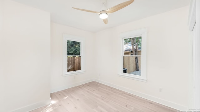 unfurnished room with ceiling fan and light wood-type flooring