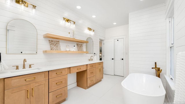 bathroom with vanity, wooden walls, tile patterned floors, and a washtub