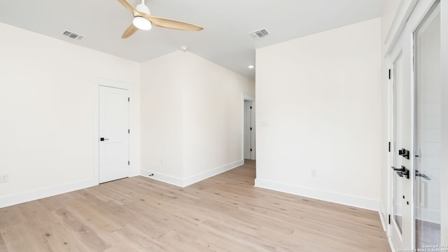 empty room featuring ceiling fan and light wood-type flooring