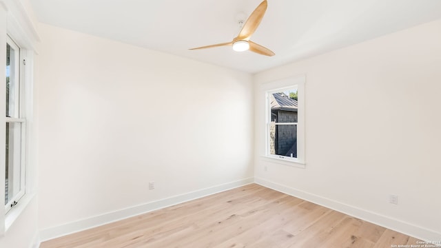 unfurnished room with light wood-type flooring