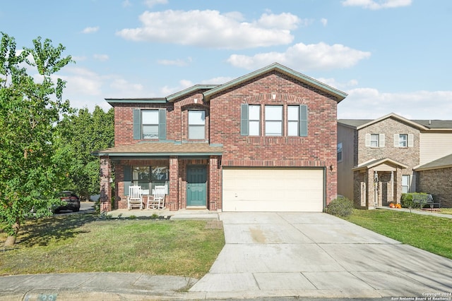 view of front facade featuring a front yard and a garage