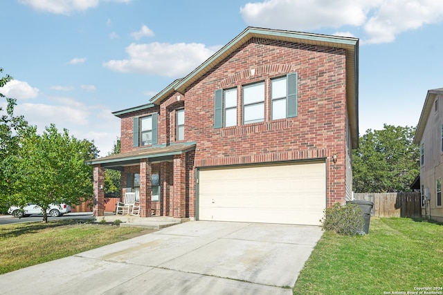 front facade with a garage and a front lawn