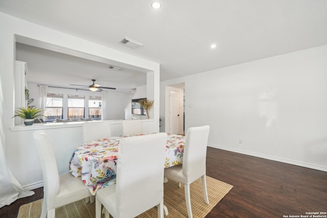 dining area featuring dark wood-type flooring and ceiling fan