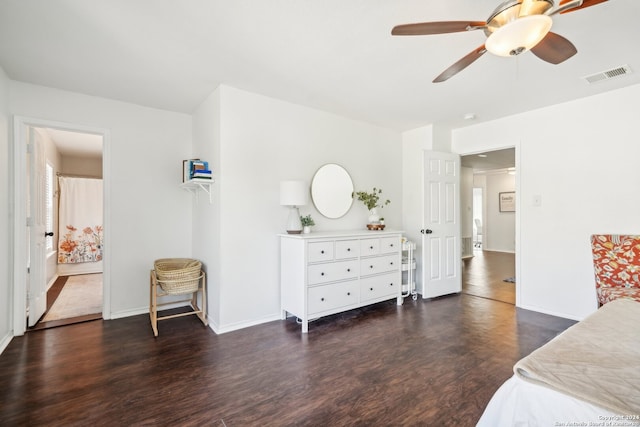 bedroom with dark hardwood / wood-style flooring and ceiling fan