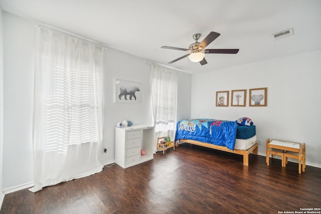 bedroom with dark wood-type flooring and ceiling fan