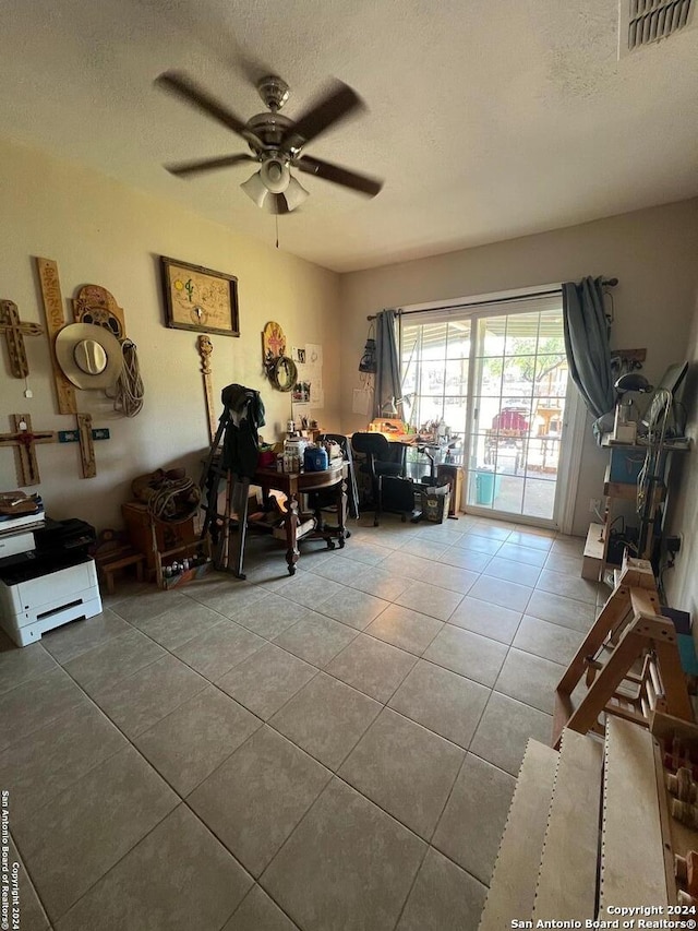 miscellaneous room with a textured ceiling, tile patterned floors, and ceiling fan