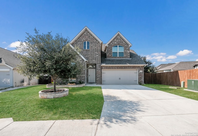 front of property with a front lawn and a garage