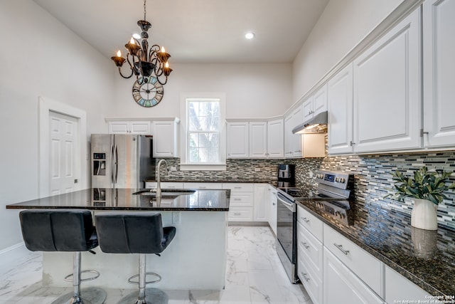 kitchen featuring sink, appliances with stainless steel finishes, and white cabinetry