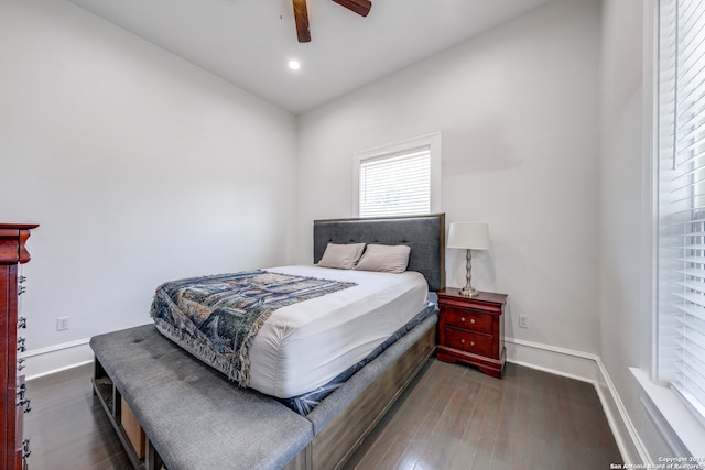 bedroom featuring ceiling fan and dark hardwood / wood-style floors