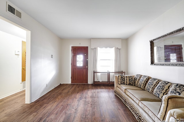 unfurnished living room featuring dark hardwood / wood-style flooring