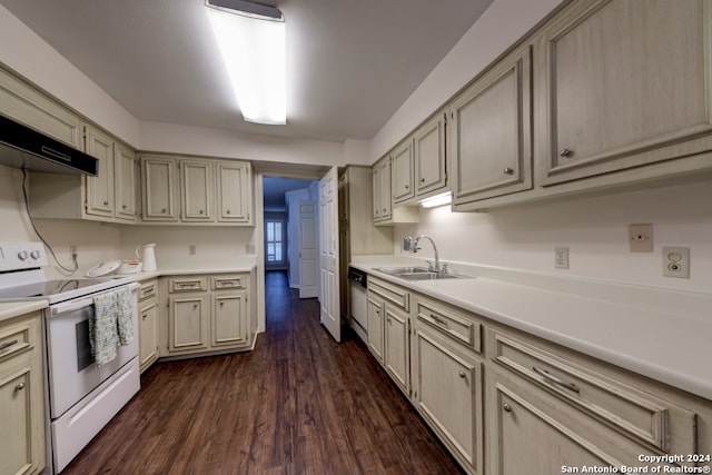 kitchen featuring sink, cream cabinetry, white appliances, and dark hardwood / wood-style flooring