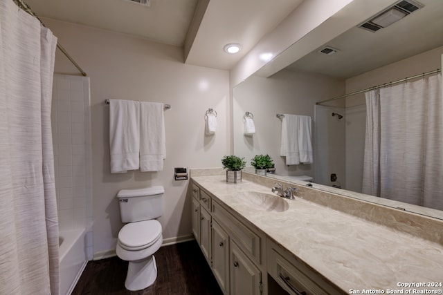 full bathroom featuring vanity, shower / tub combo with curtain, toilet, and wood-type flooring