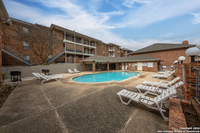 view of pool featuring a patio area