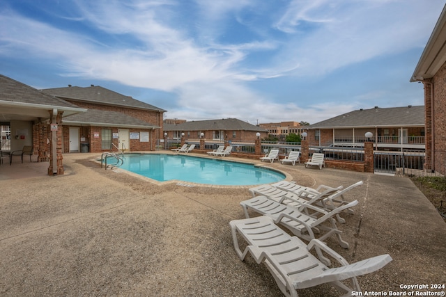 view of pool featuring a patio