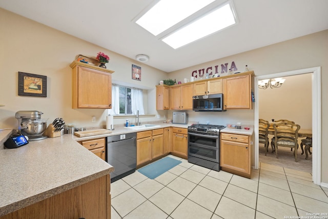 kitchen with light brown cabinets, sink, a notable chandelier, light tile patterned floors, and appliances with stainless steel finishes