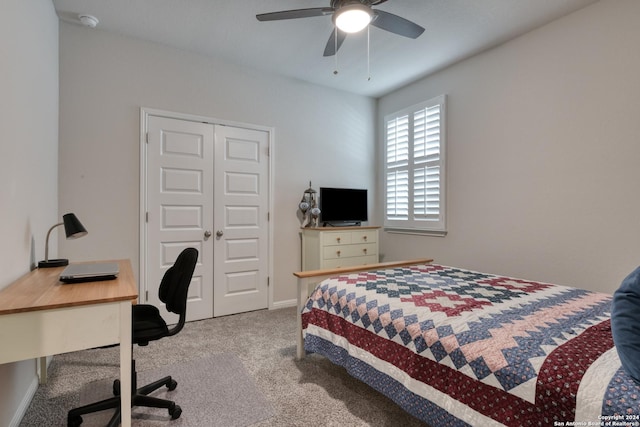 bedroom featuring ceiling fan, a closet, and light carpet