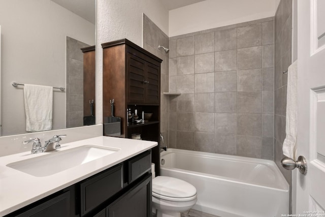 full bathroom featuring vanity, toilet, and tiled shower / bath combo