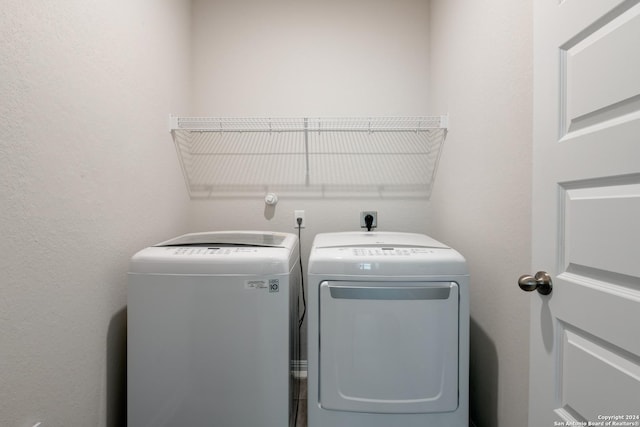 laundry room featuring washing machine and clothes dryer