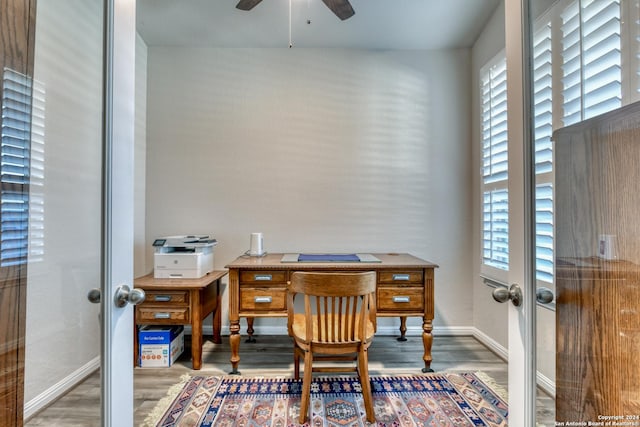 home office with french doors, hardwood / wood-style flooring, and plenty of natural light