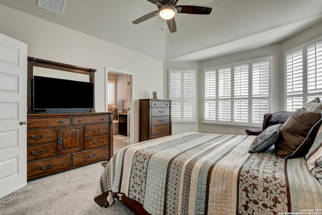 bedroom featuring ceiling fan, light carpet, and multiple windows