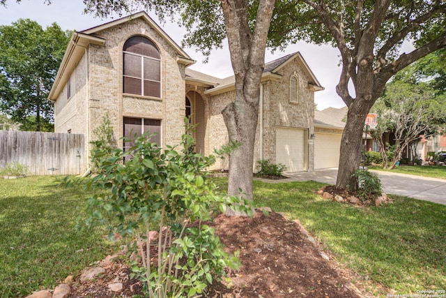 view of front facade featuring a garage and a front lawn