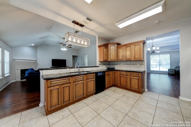 kitchen featuring light hardwood / wood-style flooring, dishwasher, sink, and lofted ceiling