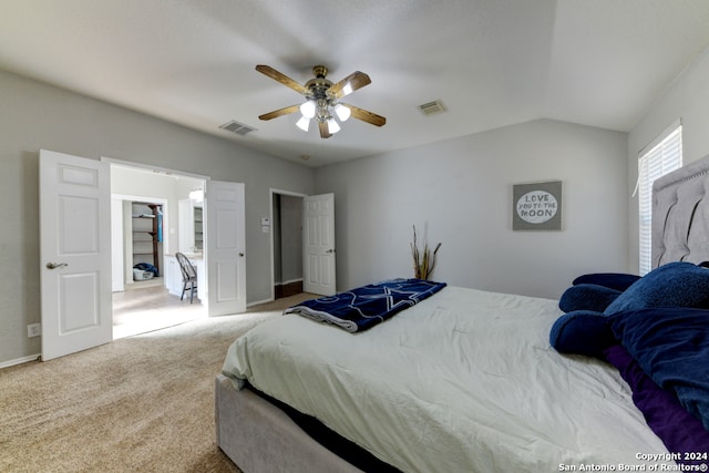 bedroom with lofted ceiling, carpet flooring, and ceiling fan