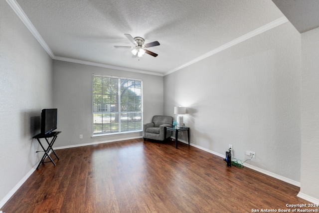 unfurnished room featuring ornamental molding, ceiling fan, a textured ceiling, and dark hardwood / wood-style flooring