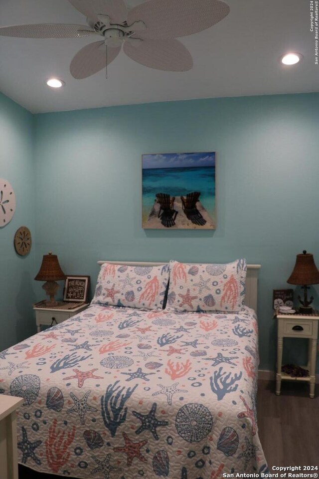 bedroom featuring wood-type flooring and ceiling fan