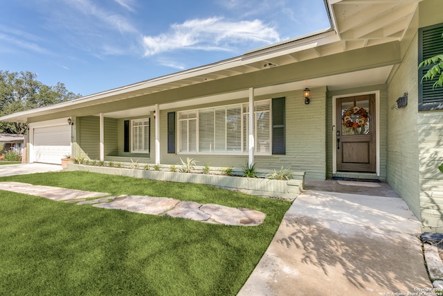 view of front of property with a front lawn and a garage