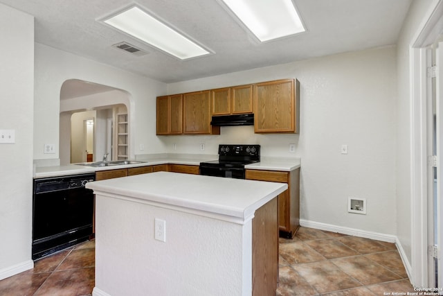 kitchen with extractor fan, sink, black appliances, a center island, and light tile patterned floors