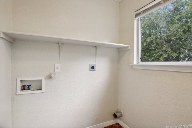 washroom with hookup for an electric dryer and hookup for a washing machine