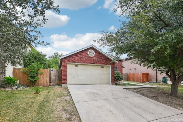 ranch-style house with a front lawn and a garage