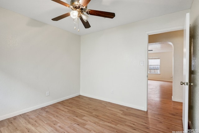 spare room featuring light wood-type flooring and ceiling fan