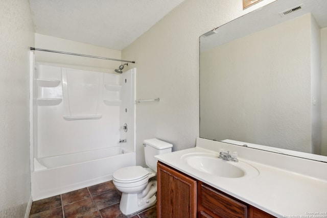 full bathroom with toilet, tile patterned flooring, bathing tub / shower combination, vanity, and a textured ceiling